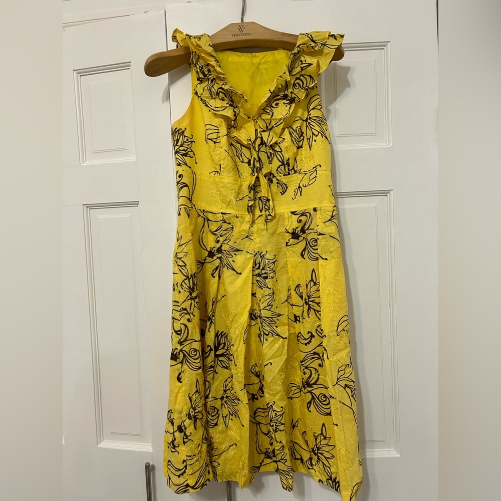 Yellow summer dress with flowers stitches